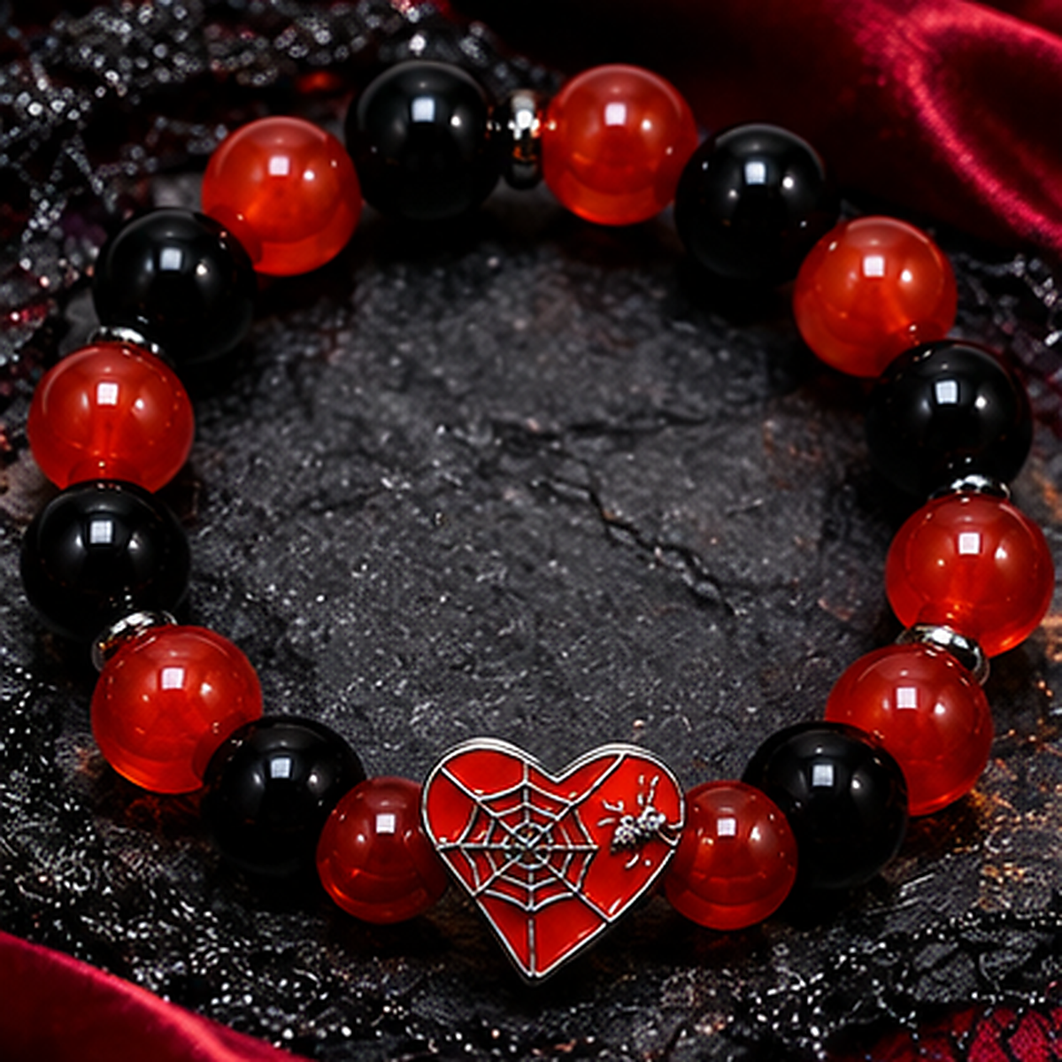 Style 3 red and black spiderweb heart Halloween bracelet on dark seasonal background
