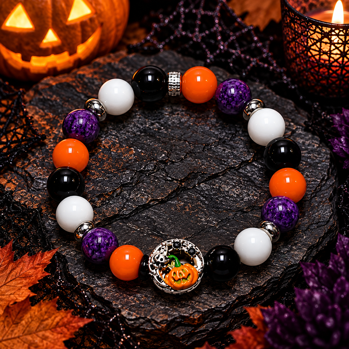 Style 5 purple orange black and white Halloween bracelet with ornate pumpkin and skull charm on dark slate