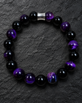 Men's 10mm Black Obsidian and Purple Tiger Eye bracelet on charcoal slate with silver-tone centerpiece